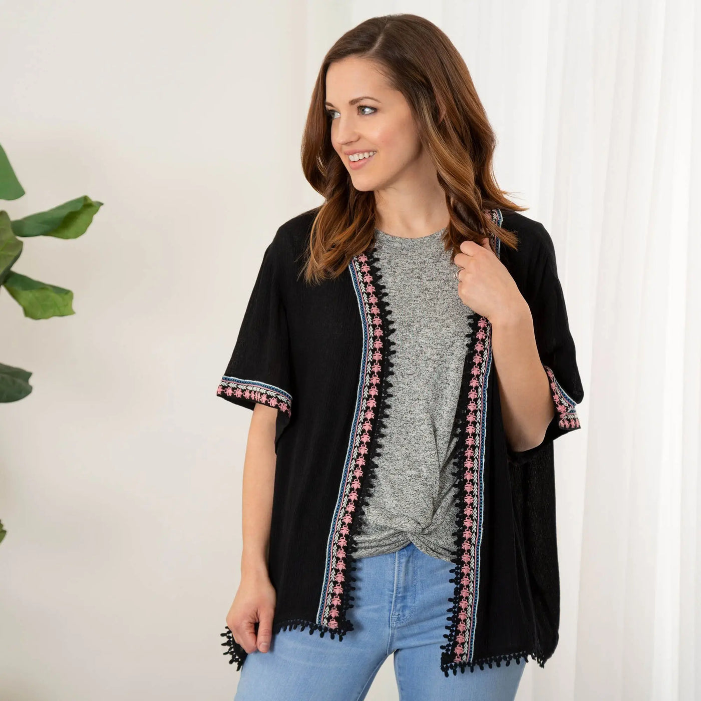 Midnight Muse open-front black cardigan with pink and blue embroidered trim and fringe detailing
