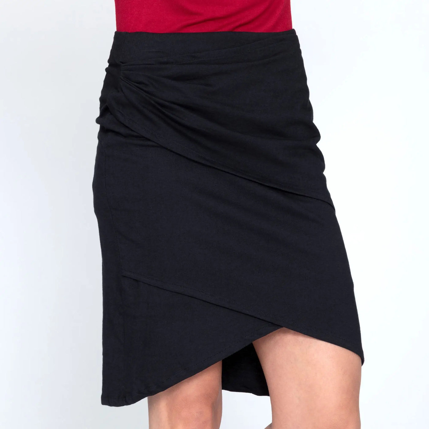Black organic layered pencil skirt with asymmetrical draped ruched waistband made from sustainable fabric