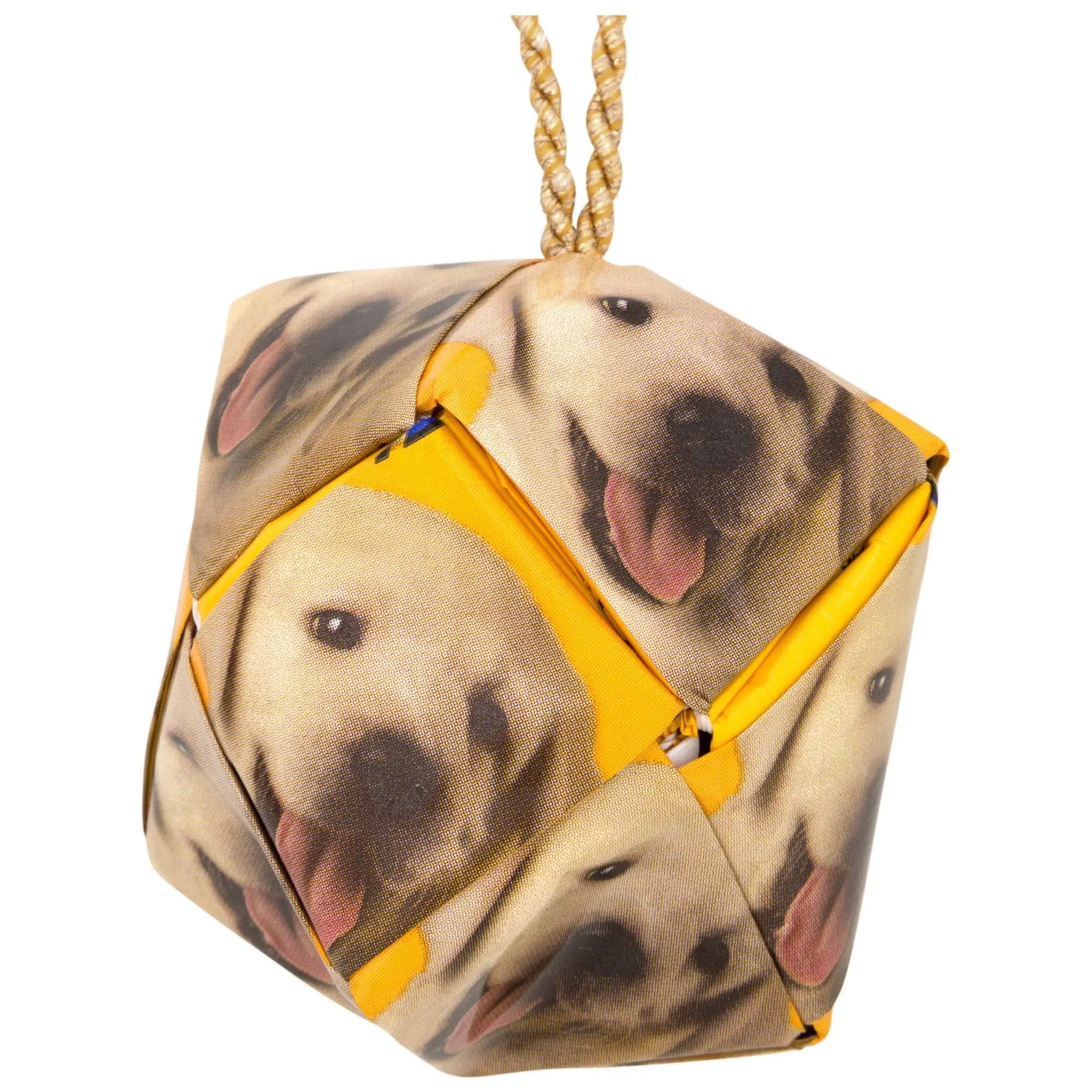 A cube-shaped recycled dog food ornament doorstop with smiling yellow labrador print bright yellow fabric and braided rope loop