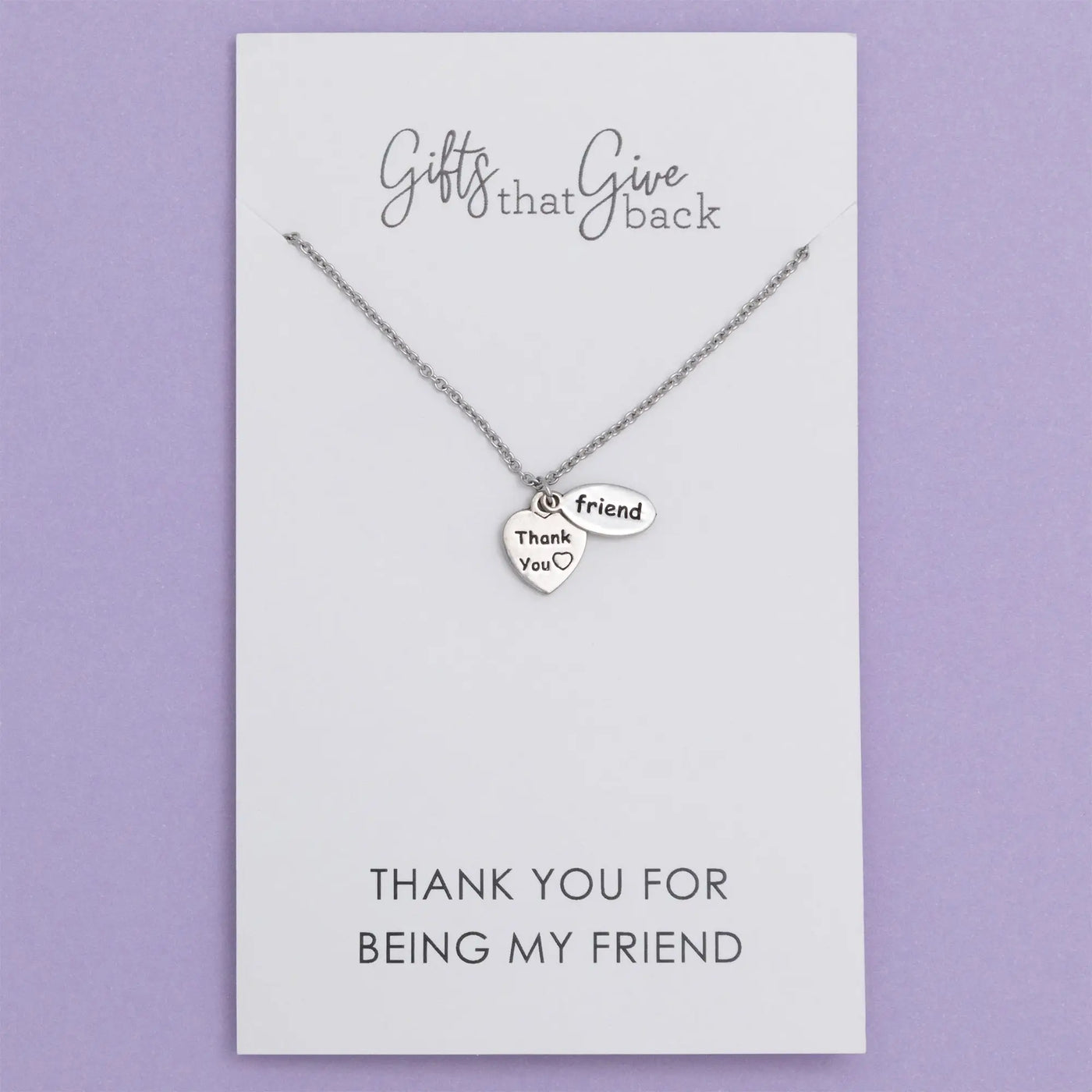 Silver sisterly love necklace with two heart pendants one engraved with thank you and a small heart symbol