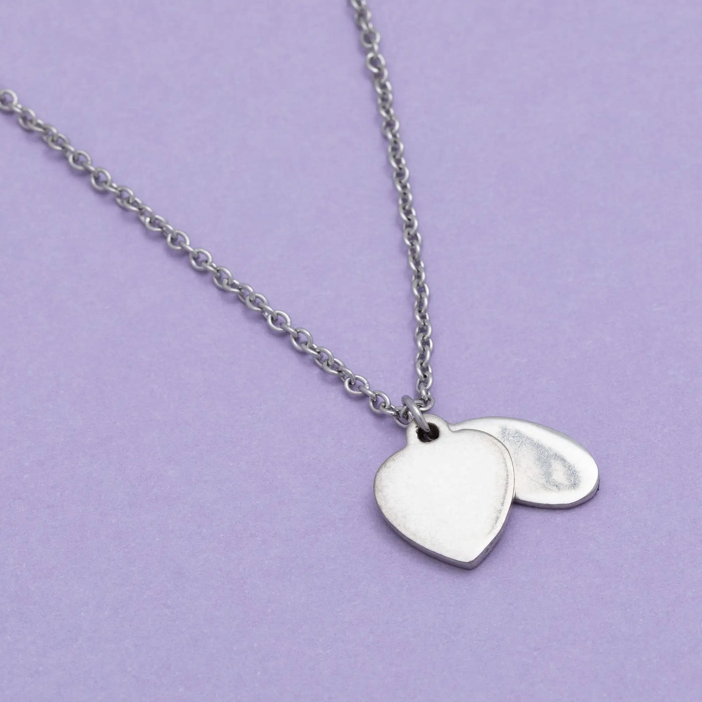 Silver heart-shaped pendant necklace with a delicate chain in the sisterly love collection