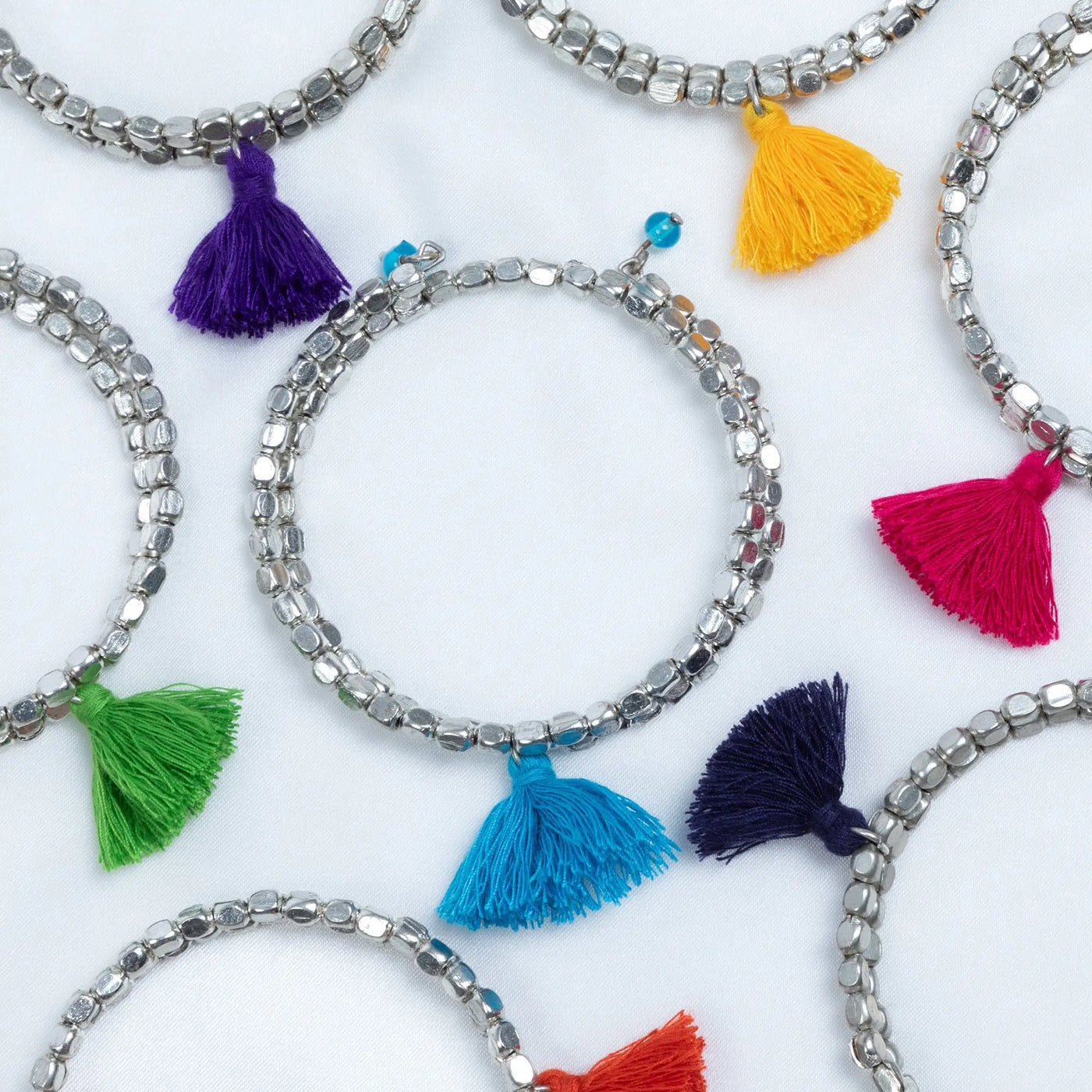Silver beaded Taj tassel metal bead bracelet with a colorful tassel charm for stylish everyday wear