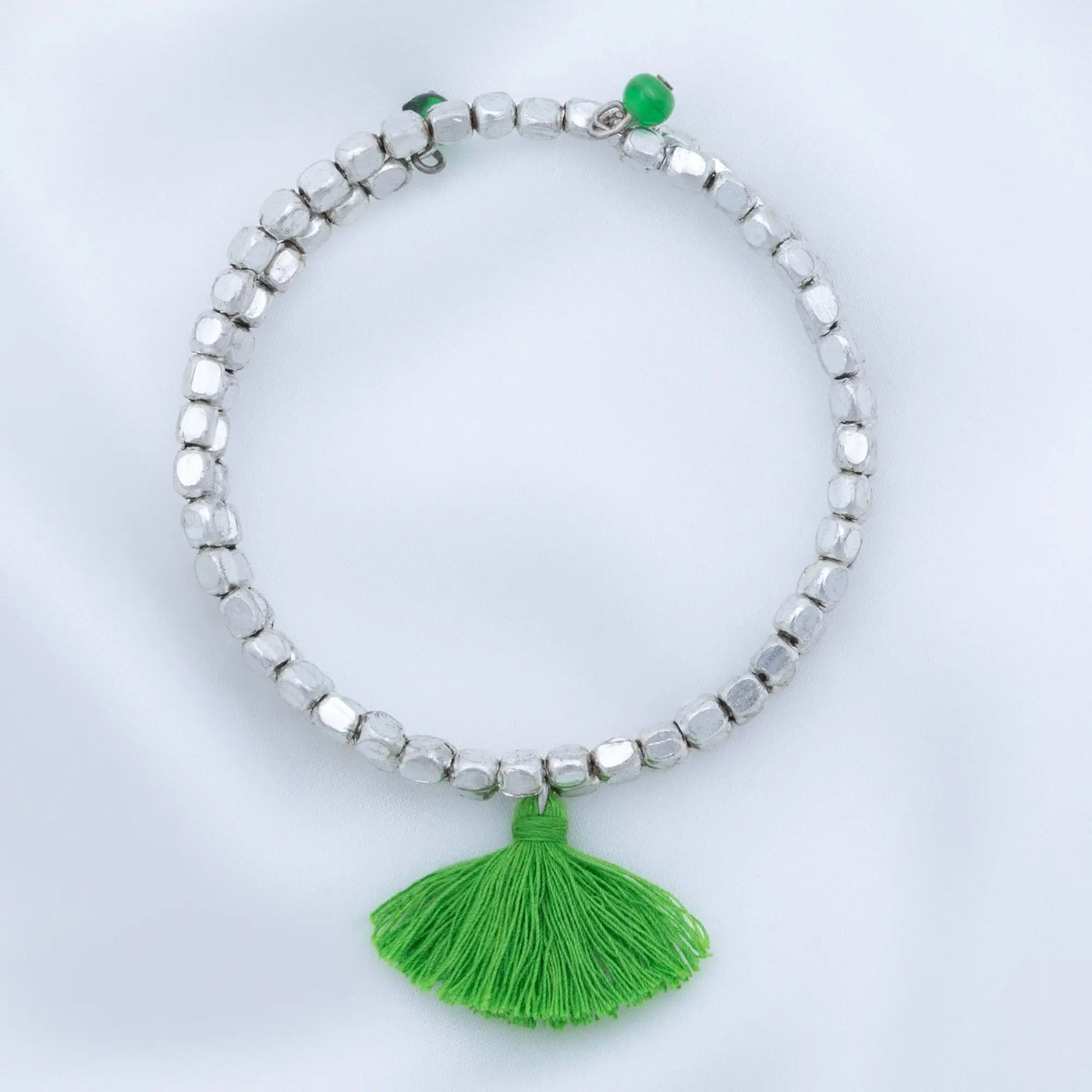 Silver beaded Taj tassel metal bead bracelet with vibrant green tassel and matching green bead accent