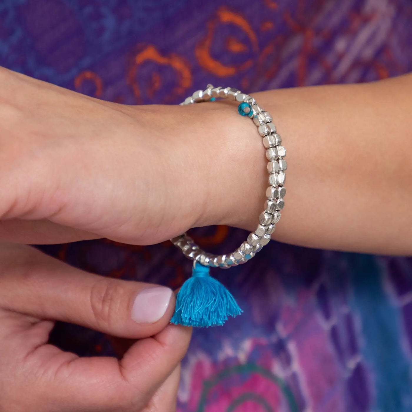 Silver beaded taj tassel metal bead bracelet with turquoise tassel charm for stylish casual wear