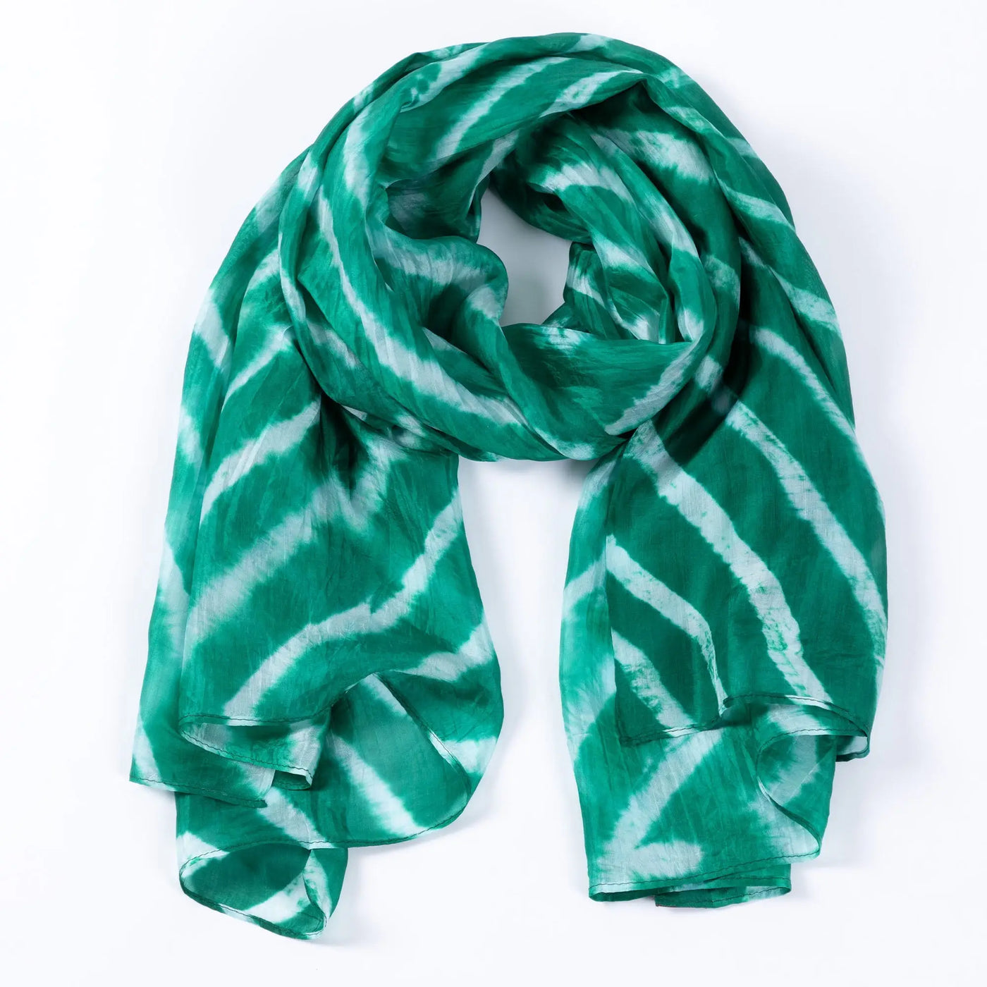 A flowing green and white tie-dye stripe silk scarf with soft lightweight fabric perfect for stylish wear
