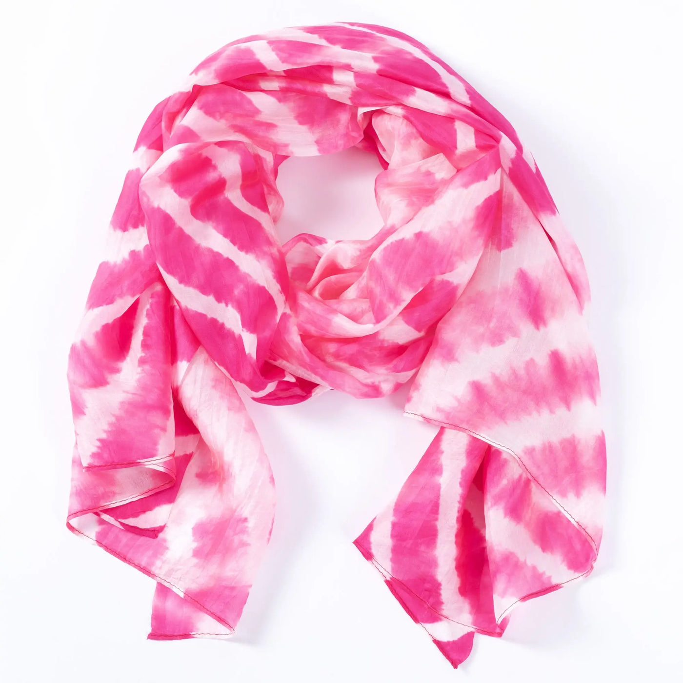 A soft flowing pink and white tie-dye stripe silk scarf with delicate lightweight fabric for stylish wear