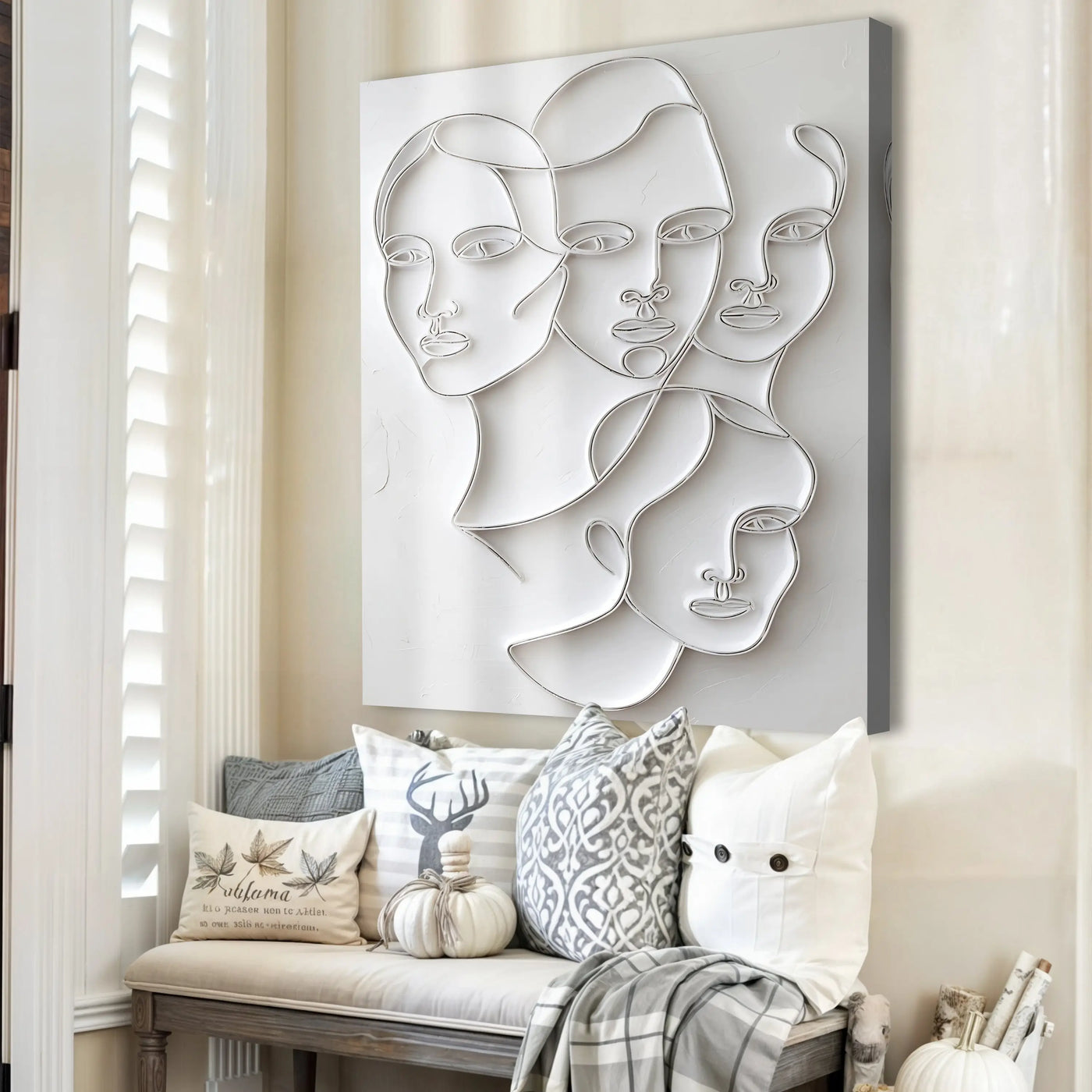 Silver metallic wire 3d minimalist faces wall art featuring abstract overlapping female faces on light gray canvas
