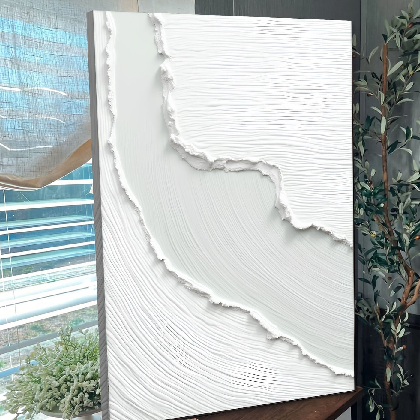 Abstract minimalist wave wall art on canvas by Tailored Canvases, featuring flowing blue and white wave design.