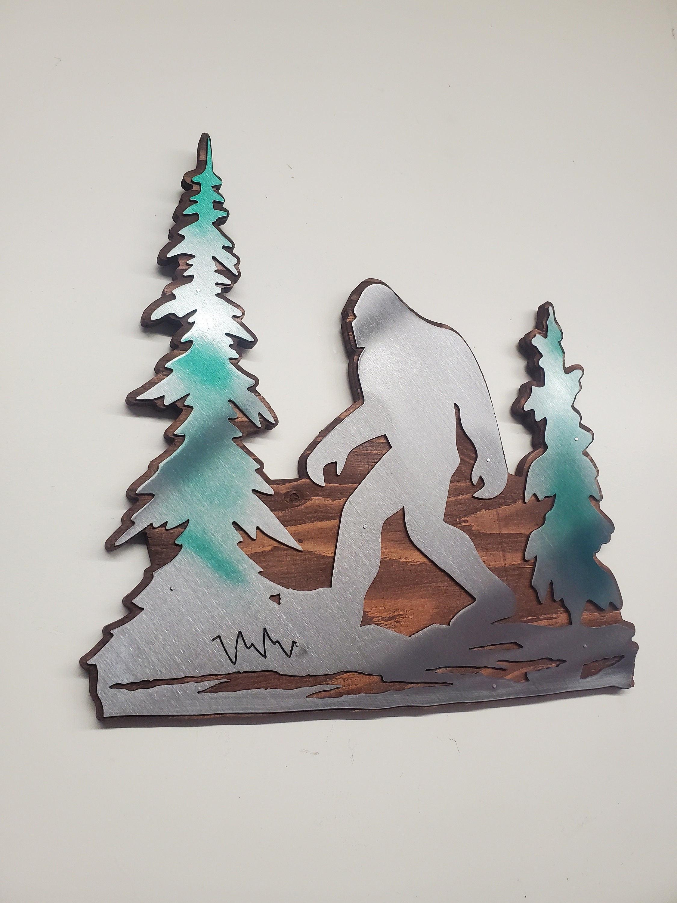 Bigfoot in trees metal art on wood Made in USA