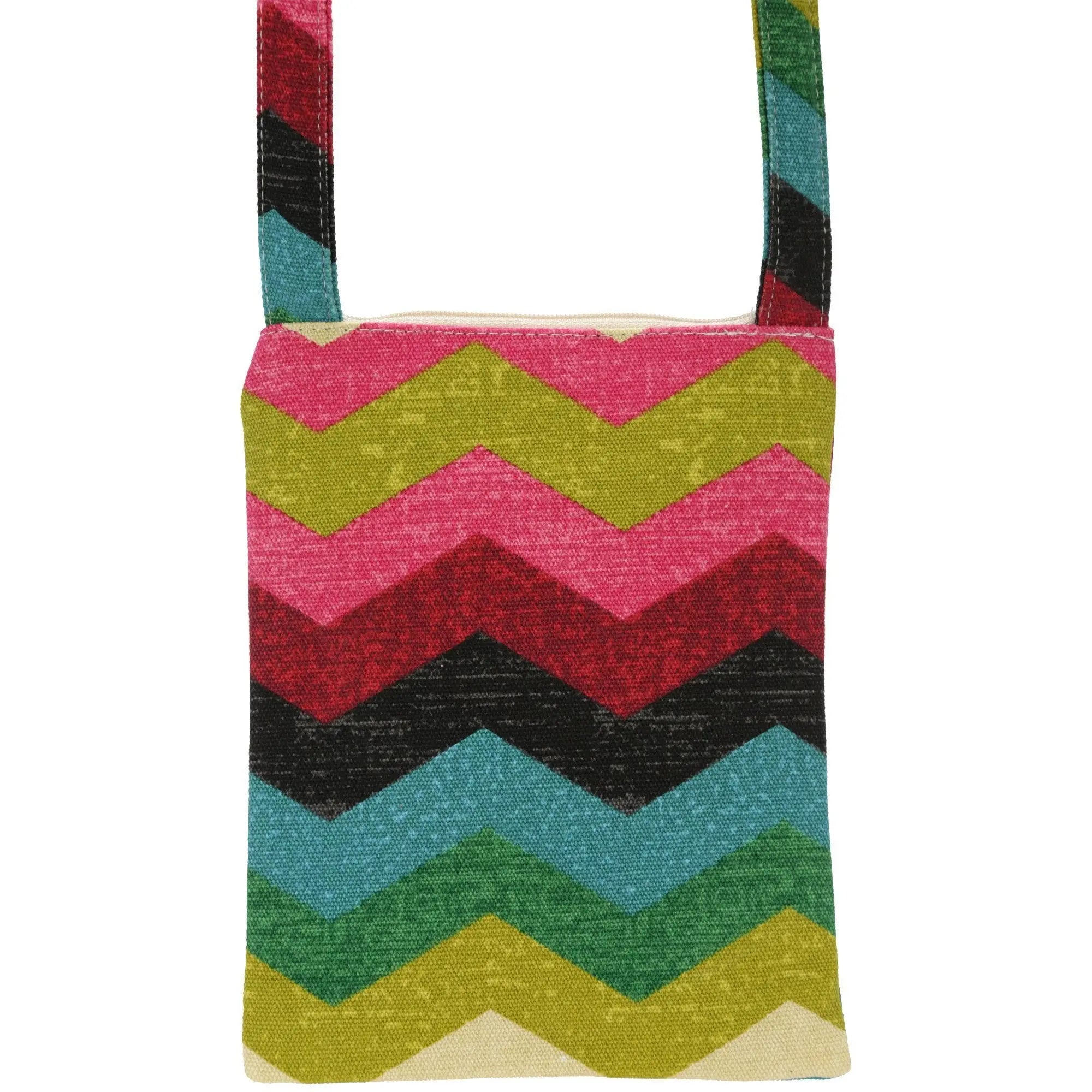 A vibrant fabric crossbody bag with a bold pink green red black and teal zigzag pattern called clever chevron sling