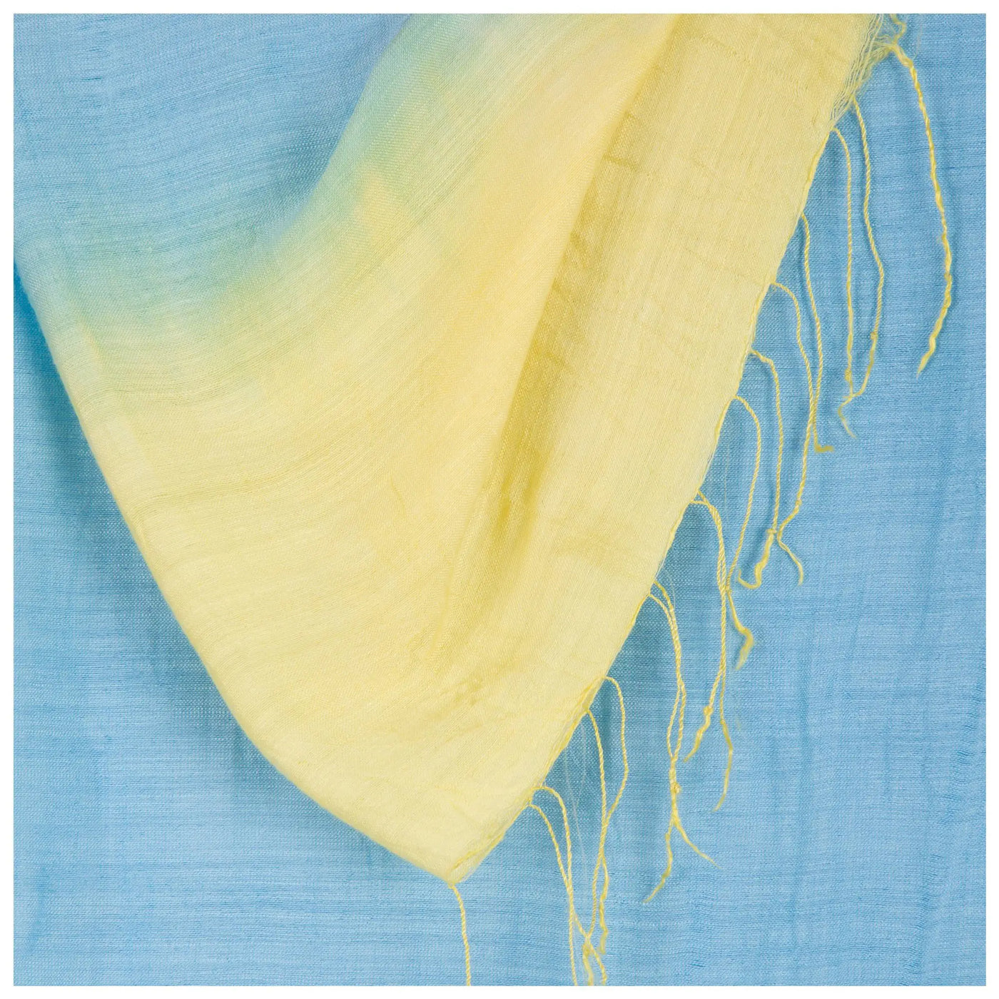 Color Connection Scarf soft pale yellow with gradient to light blue and delicate frayed edges
