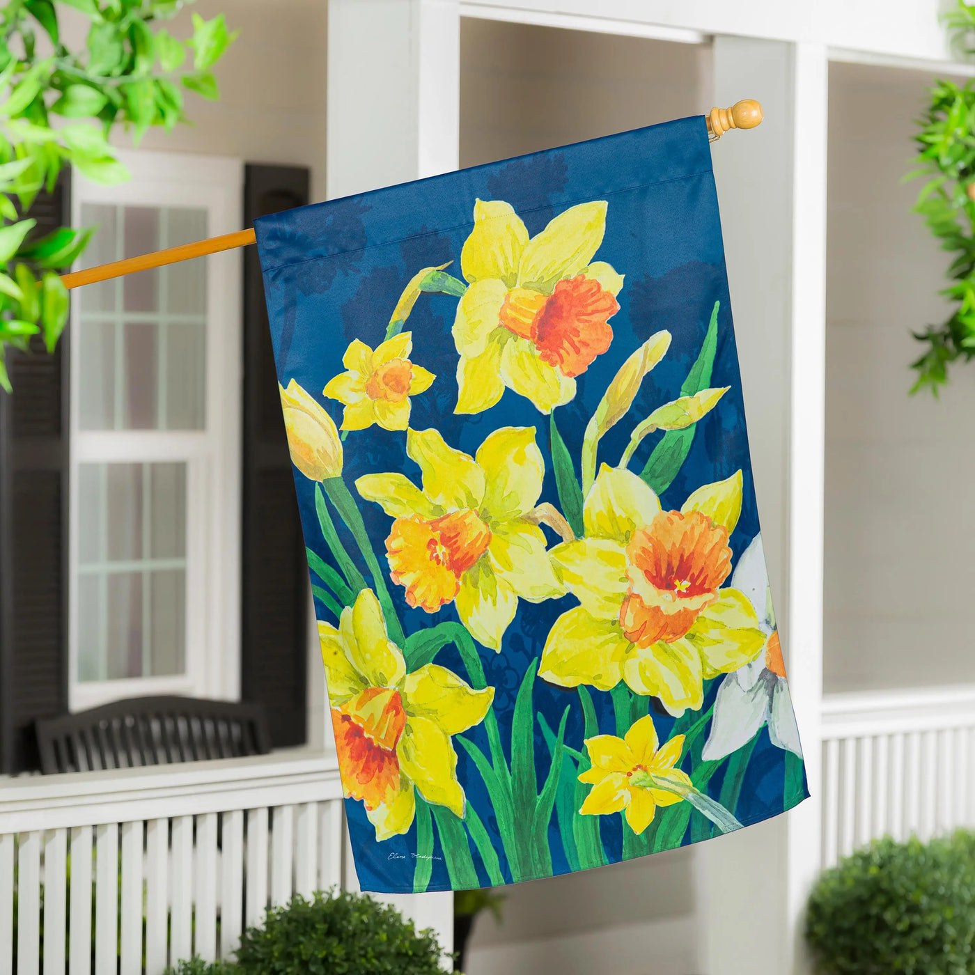 Daffodils garden suede house flag with vibrant yellow and orange daffodils blooming on a deep blue background