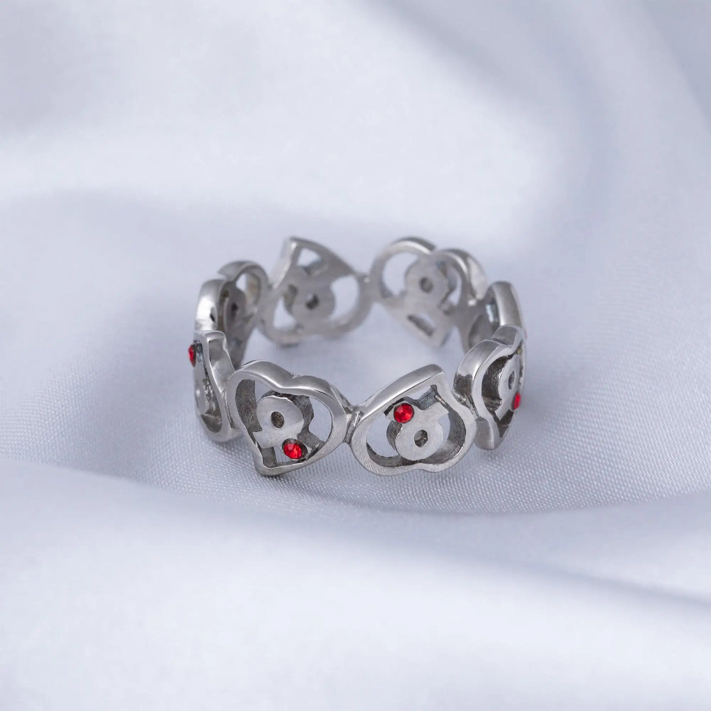 Silver stainless steel heart-shaped ring with red gemstone accents for diabetes awareness
