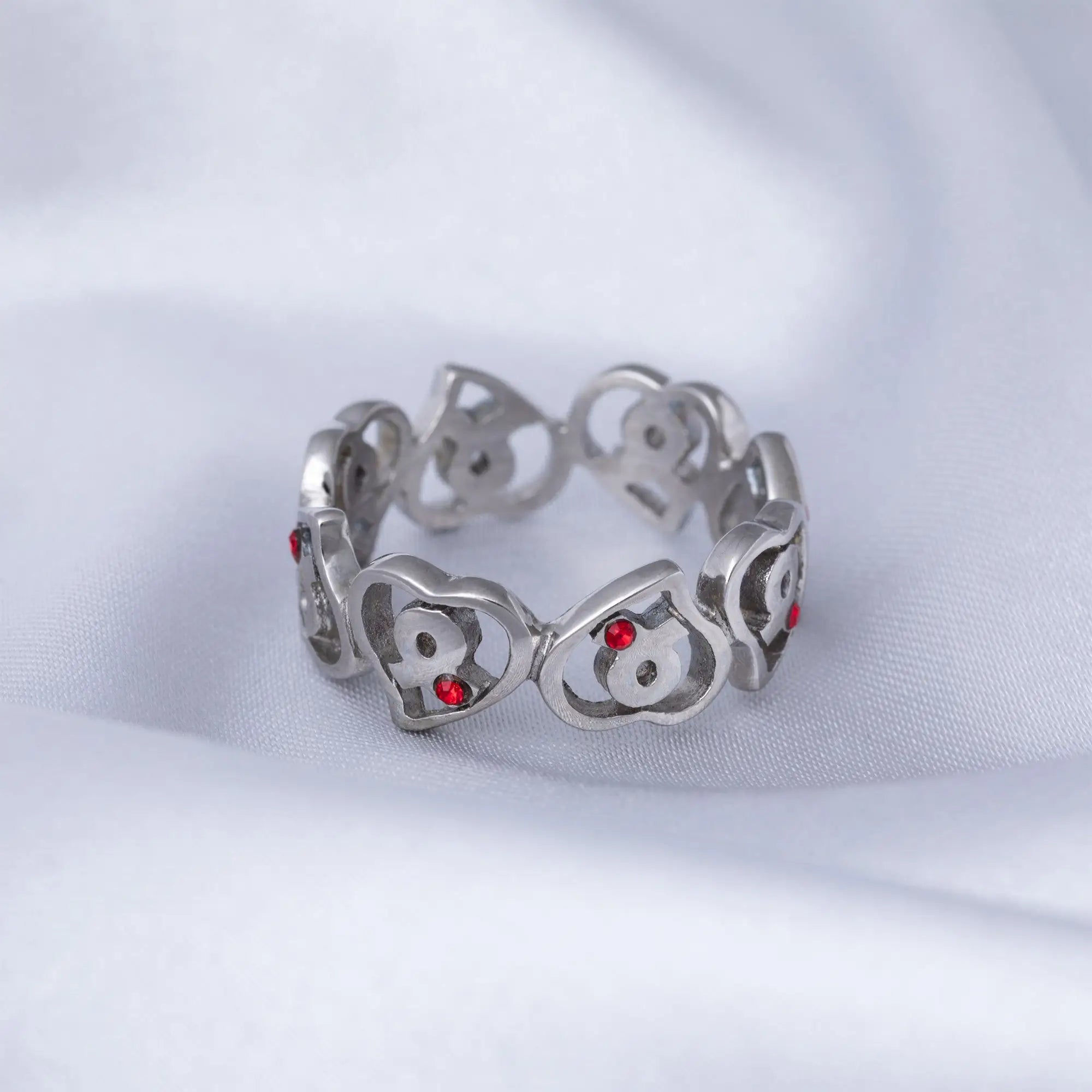 Silver stainless steel heart-shaped ring with red gemstone accents for diabetes awareness
