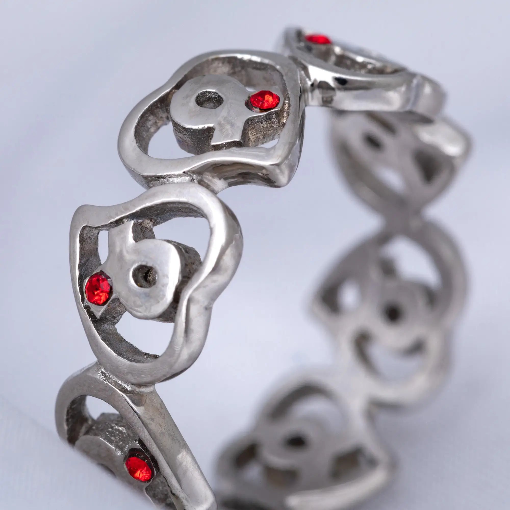 Silver skull-themed bracelet with red gemstone accents featuring diabetes awareness hearts stainless steel design
