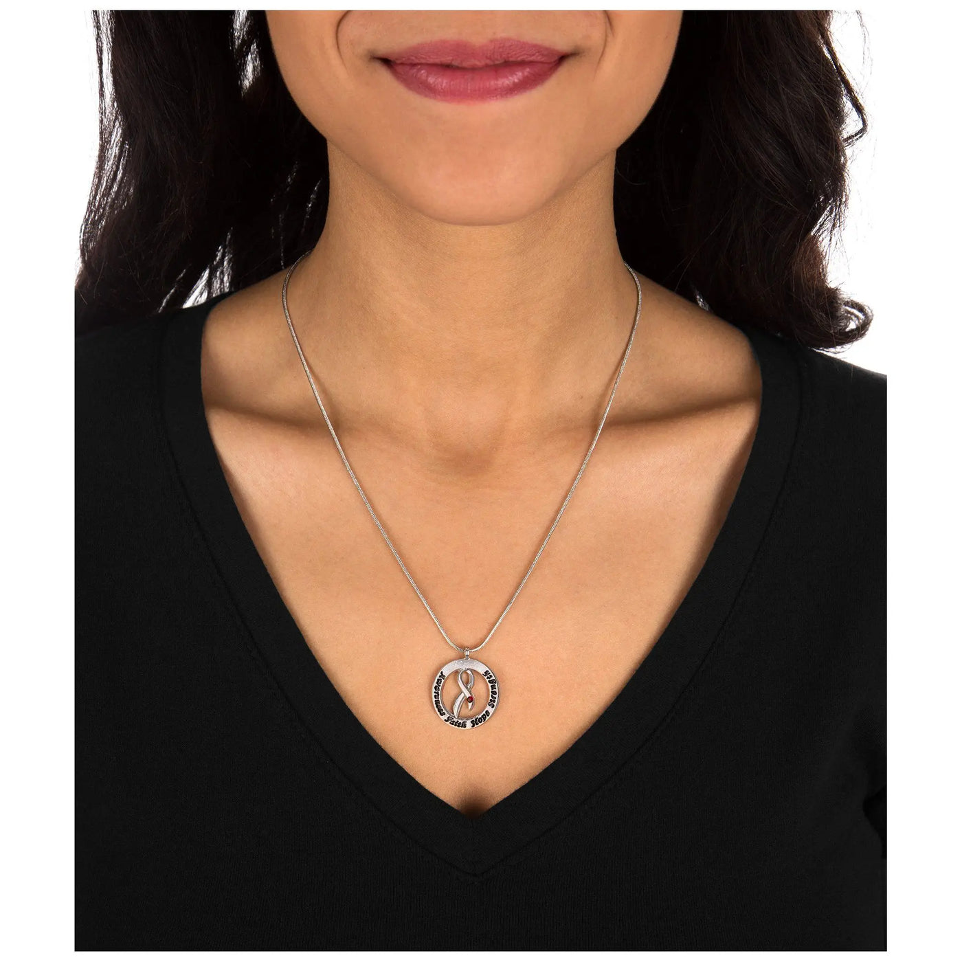Silver circular pendant necklace with pink ribbon design and engraved text on delicate chain for diabetes awareness