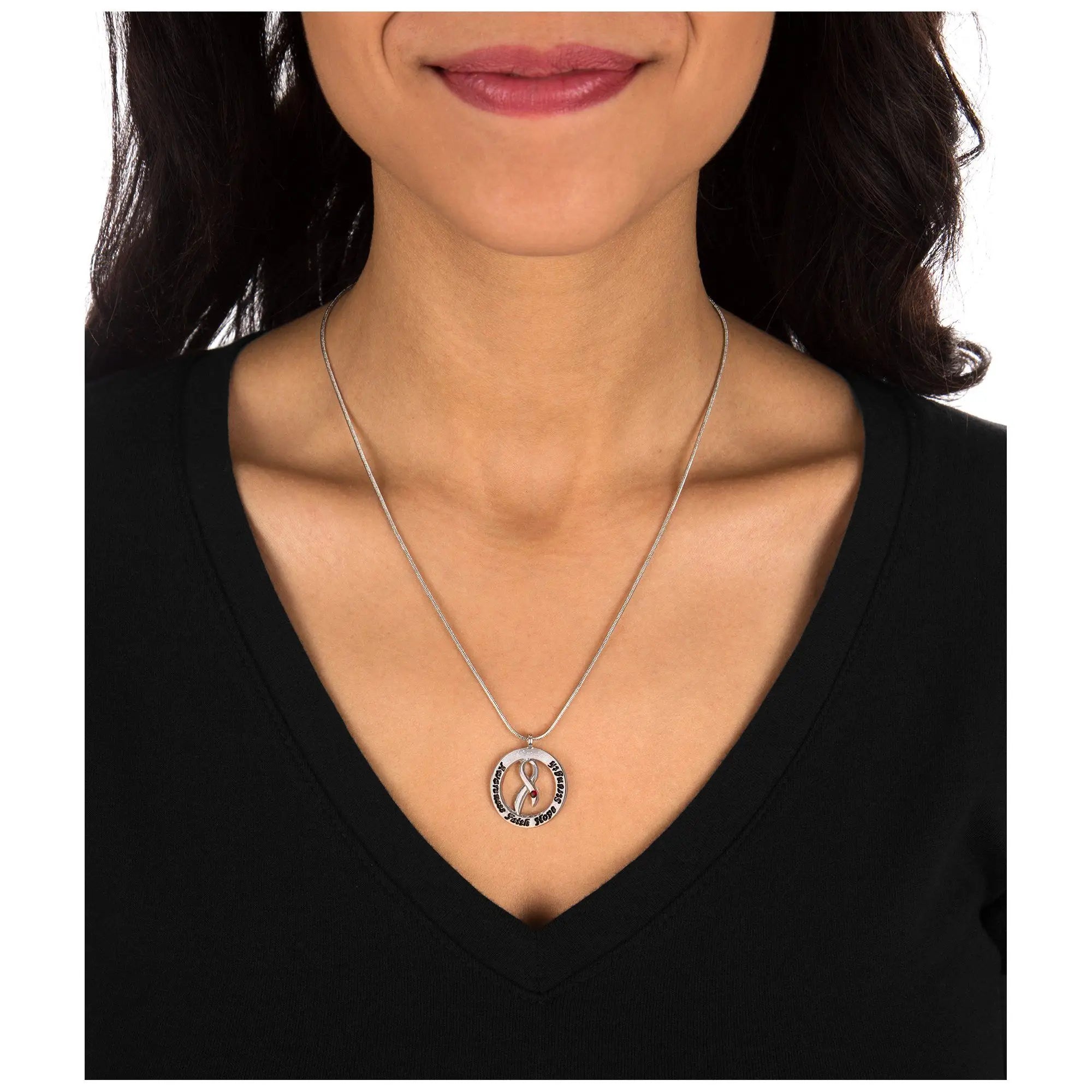 Silver circular pendant necklace with pink ribbon design and engraved text on delicate chain for diabetes awareness
