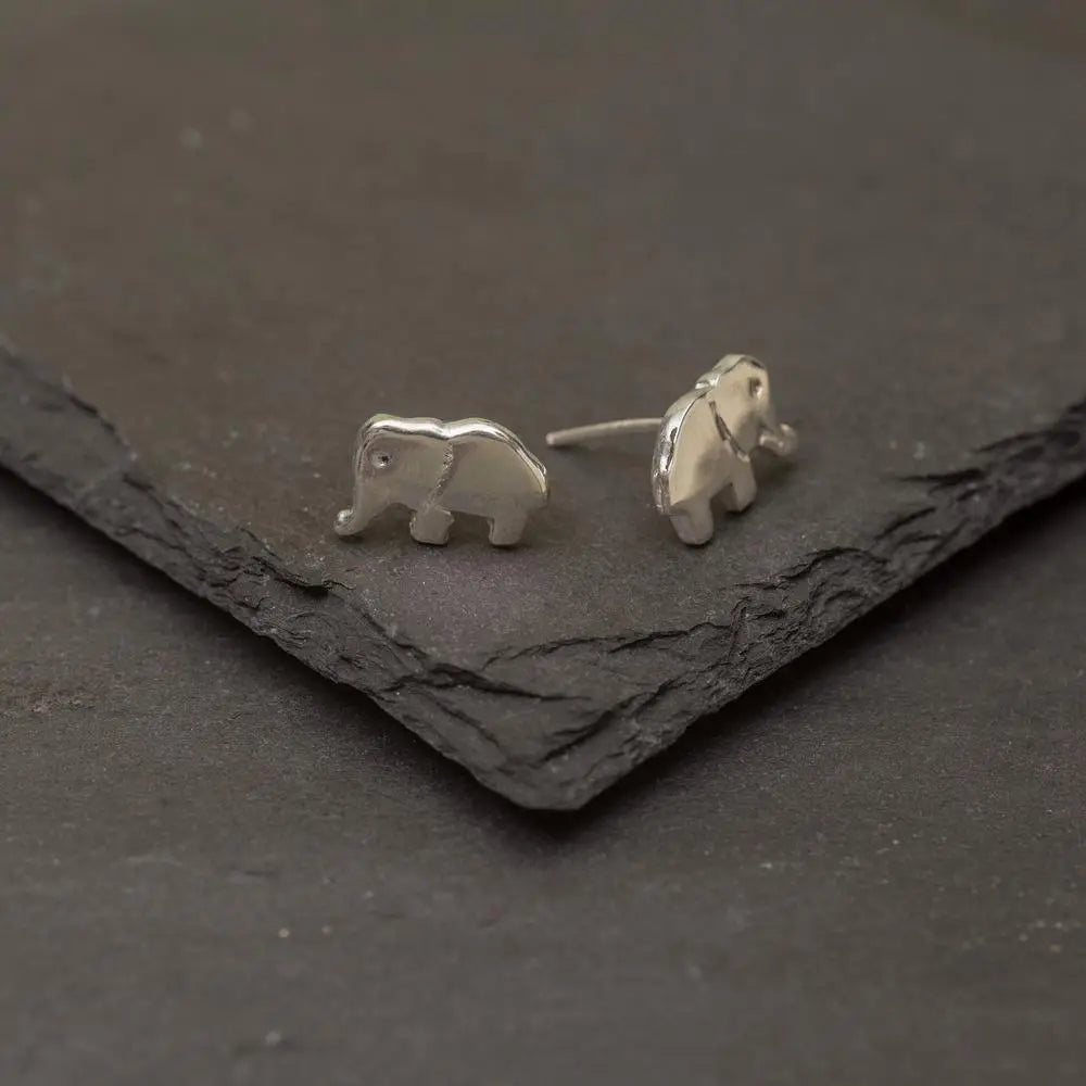 Silver elephant stud earrings with polished minimalist design made of sterling silver for everyday wear