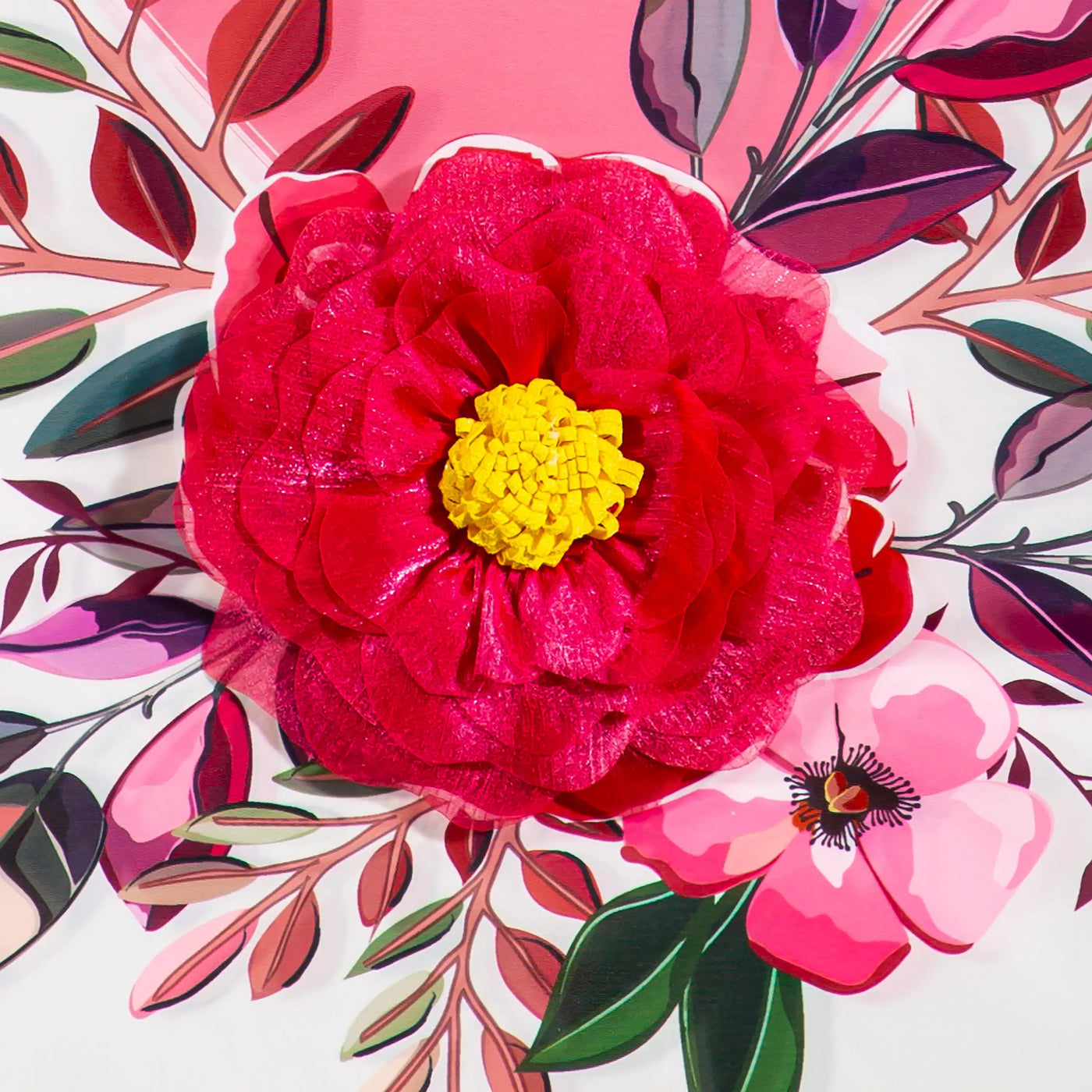 A vibrant red paper flower with layered petals and a bright yellow center on a happy valentines day floral house flag
