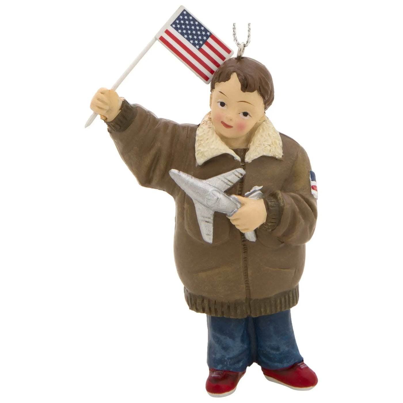 Brown pilot-themed little heroes military branch ornament featuring child in tan flight jacket holding american flag and plane