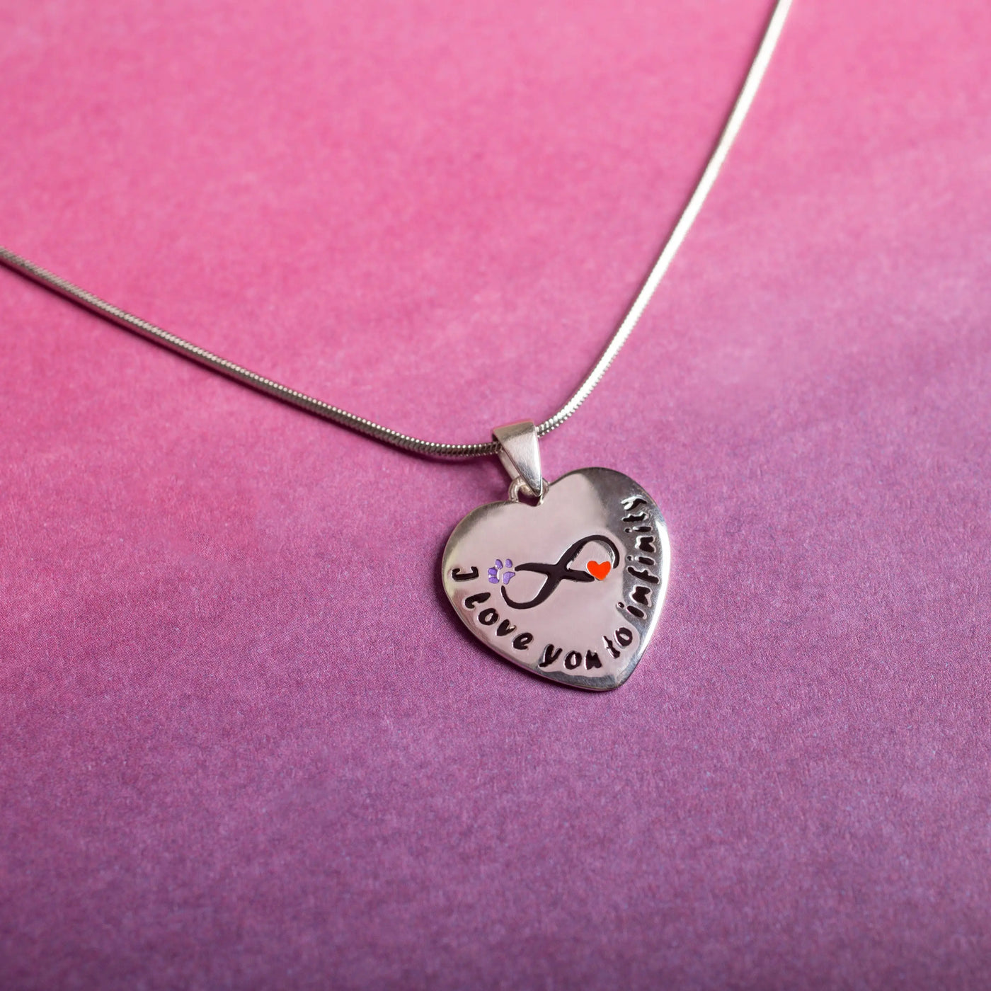 Silver heart-shaped sterling paw necklace with infinity symbol i love you to infinity and purple flower orange heart accents