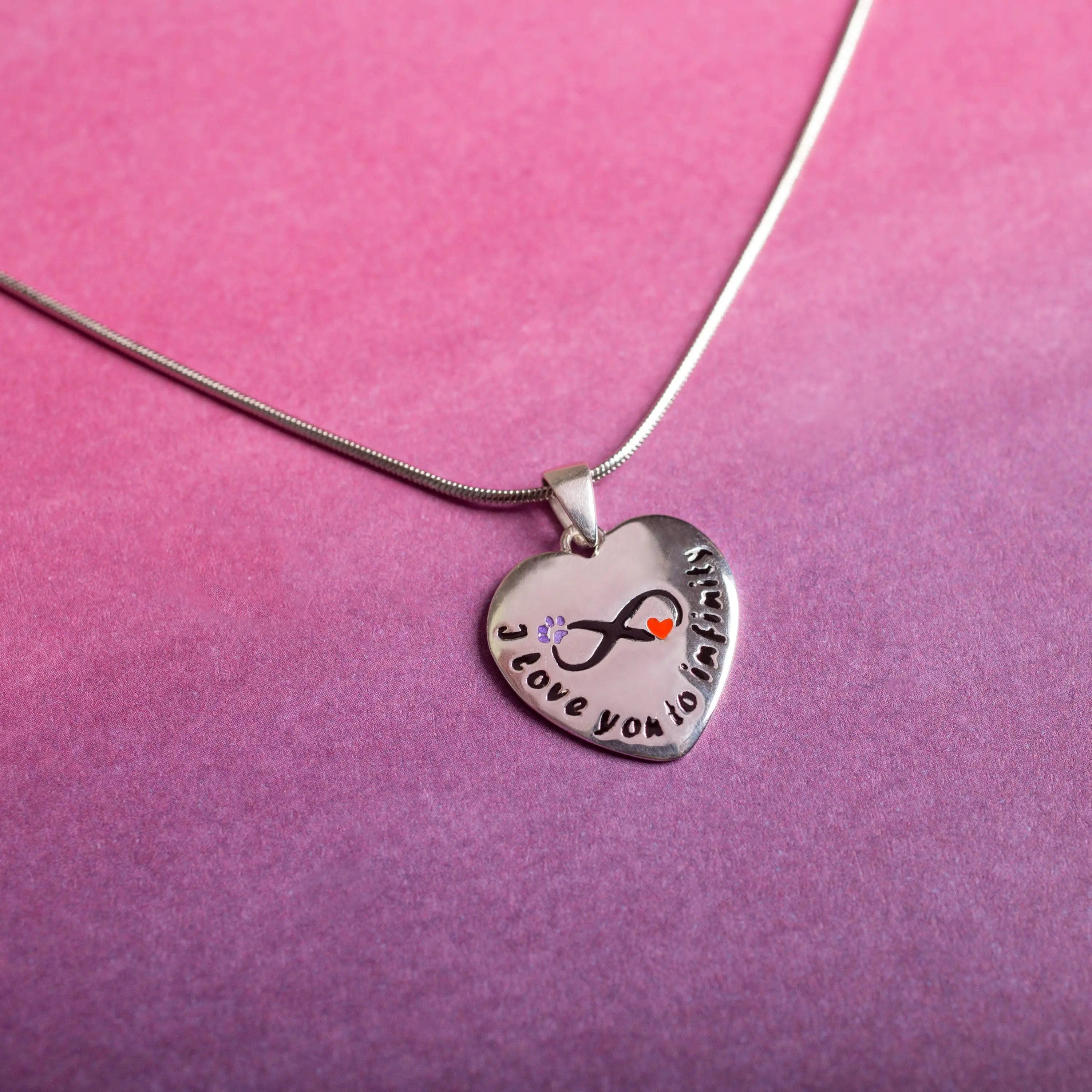 Silver heart-shaped sterling paw necklace with infinity symbol i love you to infinity and purple flower orange heart accents