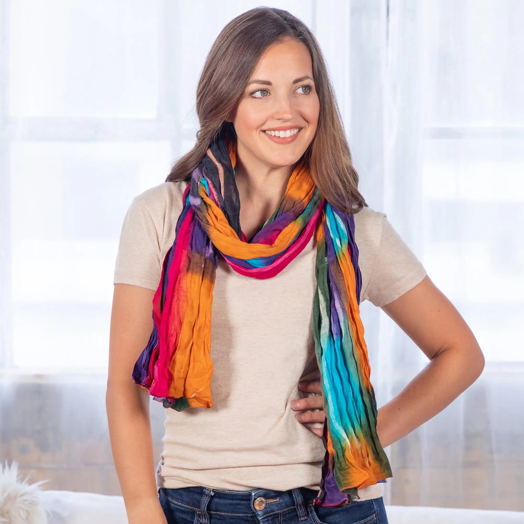 Northern Lights cotton scarf fair trade vibrant tie dye in rainbow hues of orange pink blue and purple draped around neck