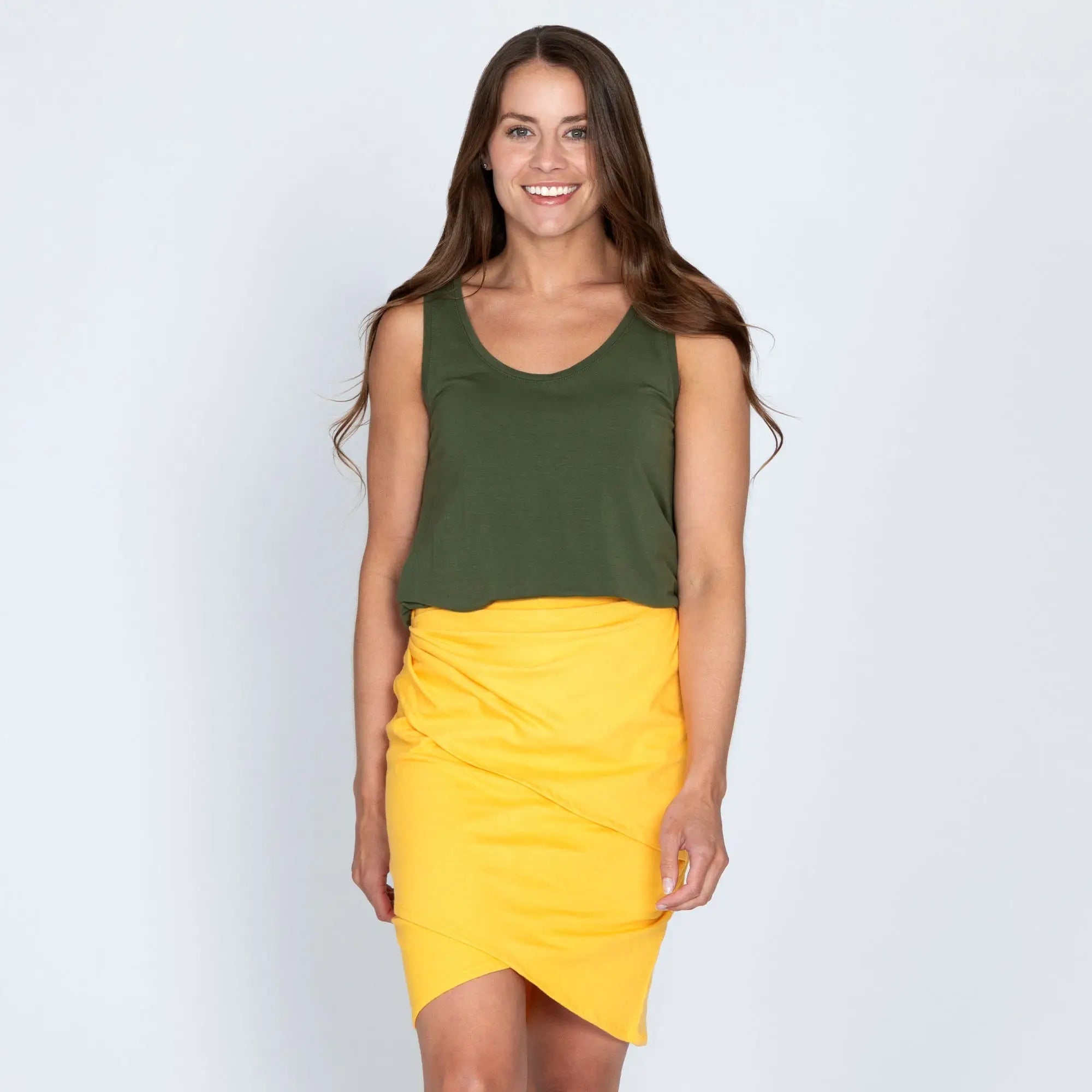 Olive green and yellow organic layered pencil skirt two-piece outfit with sleeveless top and asymmetrical wrap design
