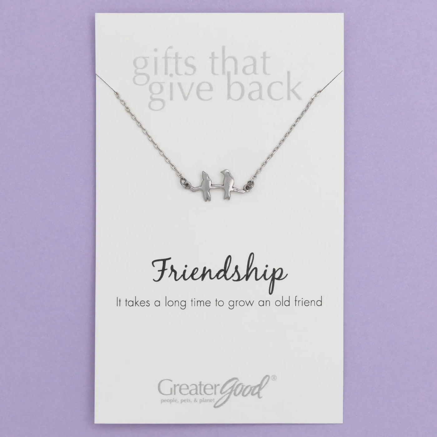 Silver sisterly love necklace with delicate chain and two gemstone adorned stylized bird figures on a branch