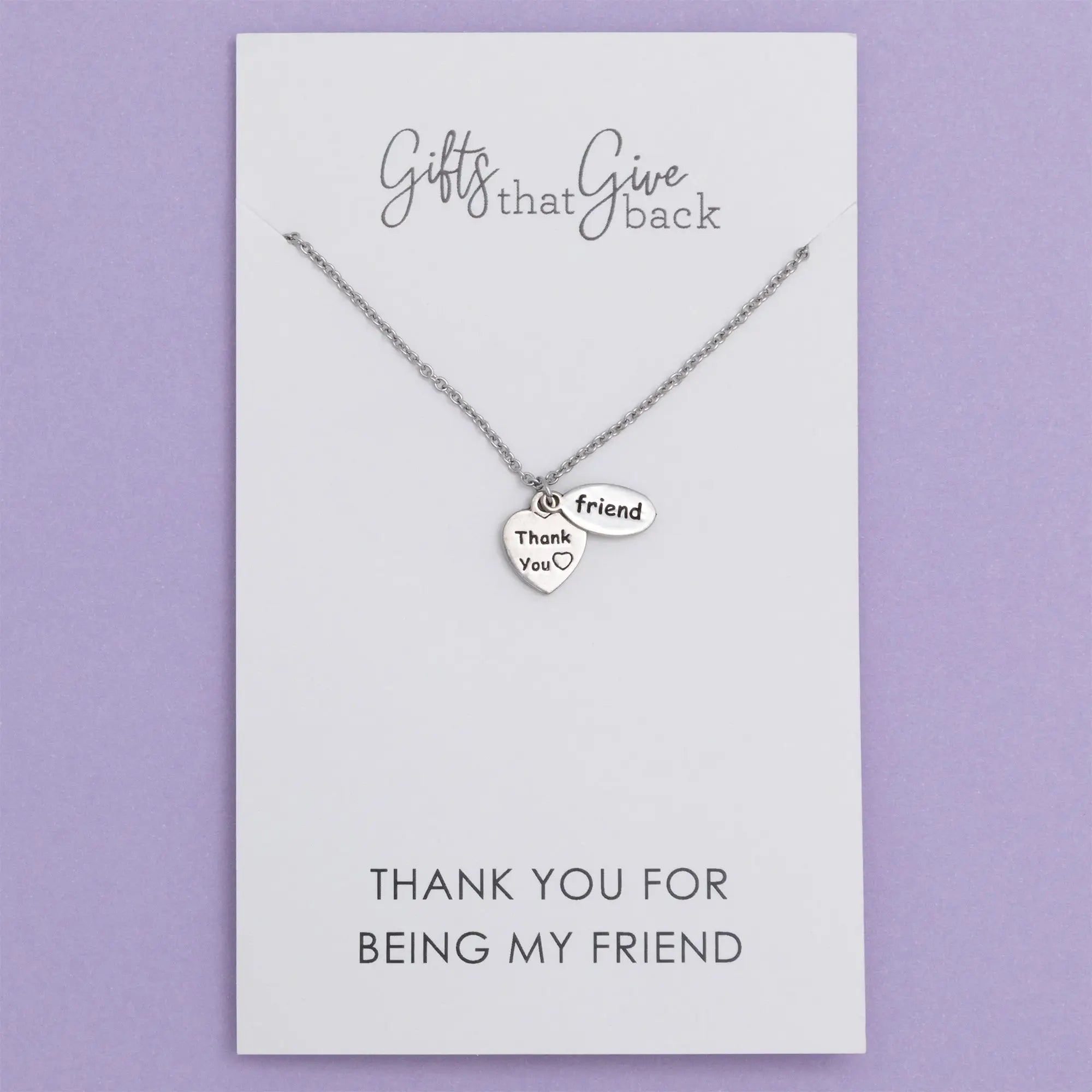 Silver sisterly love necklace with two heart pendants one engraved with thank you and a small heart symbol