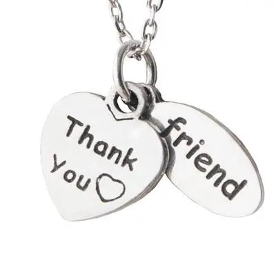 Silver heart-shaped pendant necklace engraved with thank you and friend messages for sisterly love gift