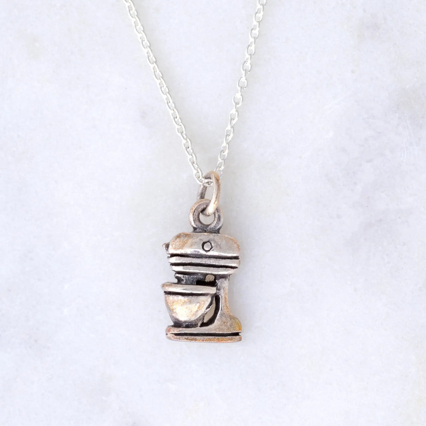 Silver-toned sterling stand mixer pendant on a delicate chain necklace for kitchen lovers and baking enthusiasts