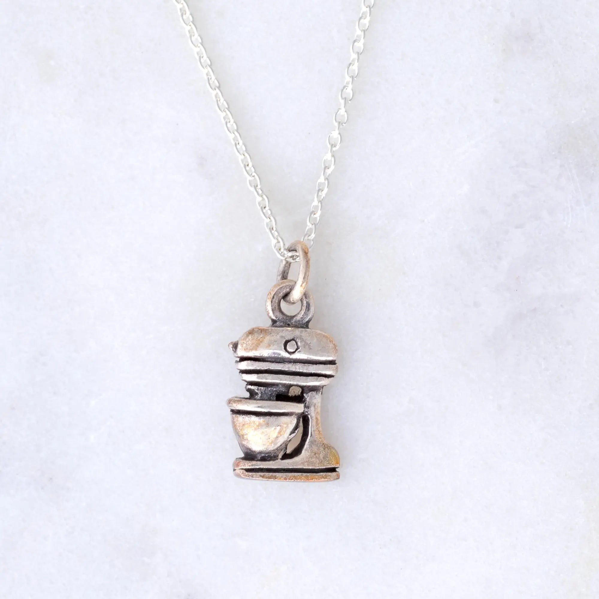 Silver-toned sterling stand mixer pendant on a delicate chain necklace for kitchen lovers and baking enthusiasts