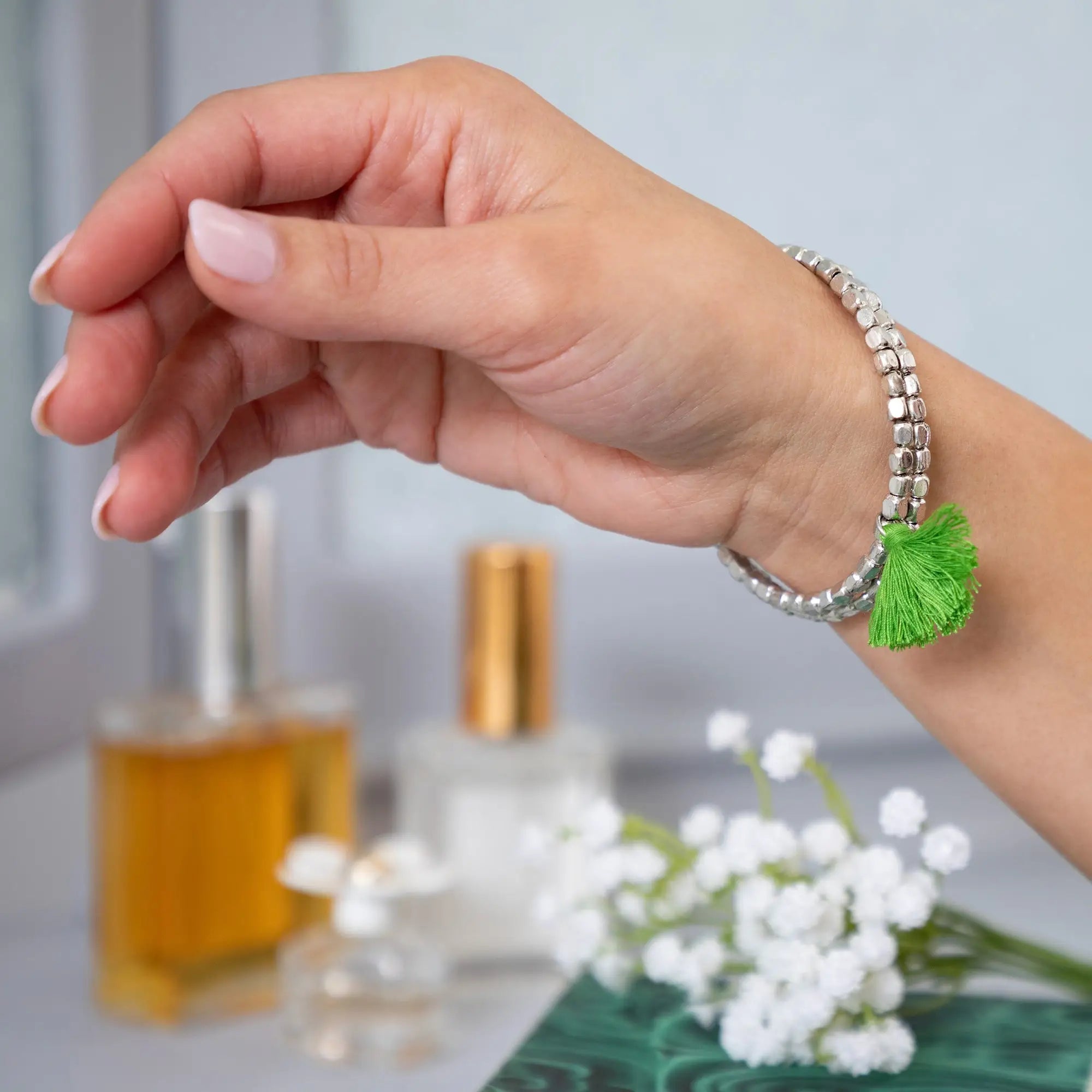 Silver beaded taj tassel metal bracelet with a vibrant green tassel accent for stylish everyday wear
