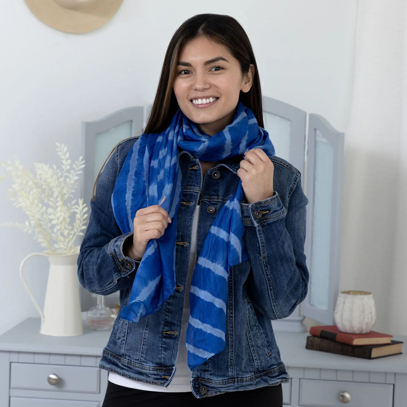A vibrant blue and white striped tie dye stripe silk scarf with soft flowing fabric perfect for stylish wear