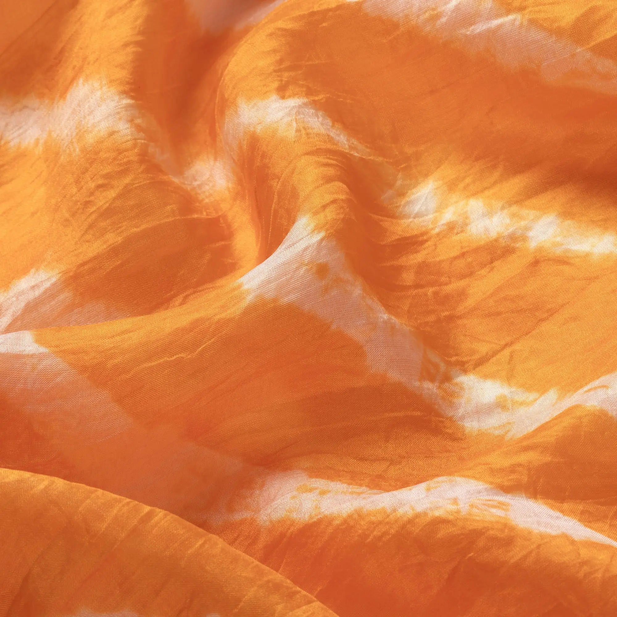 Orange and white tie-dye stripe silk scarf with a soft flowing texture perfect for stylish wear
