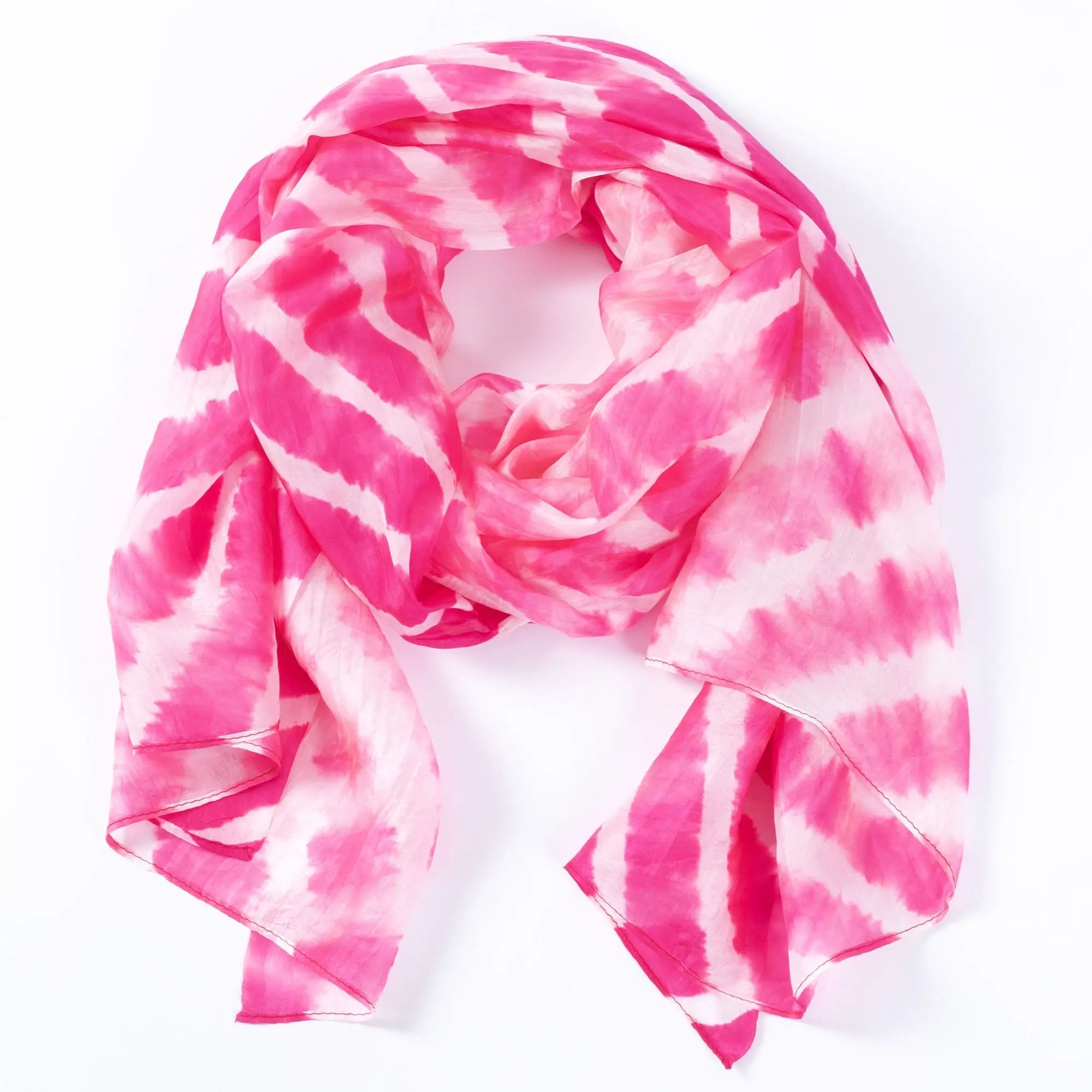 A soft flowing pink and white tie-dye stripe silk scarf with delicate lightweight fabric for stylish wear