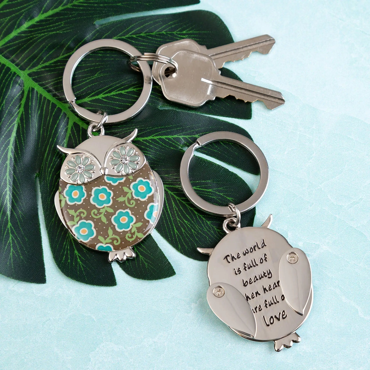 Silver owl keychain with floral pattern and engraved inspirational quote from wise in love collection